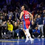 Philadelphia 76ers guard Jared McCain (20) reacts to his three pointer